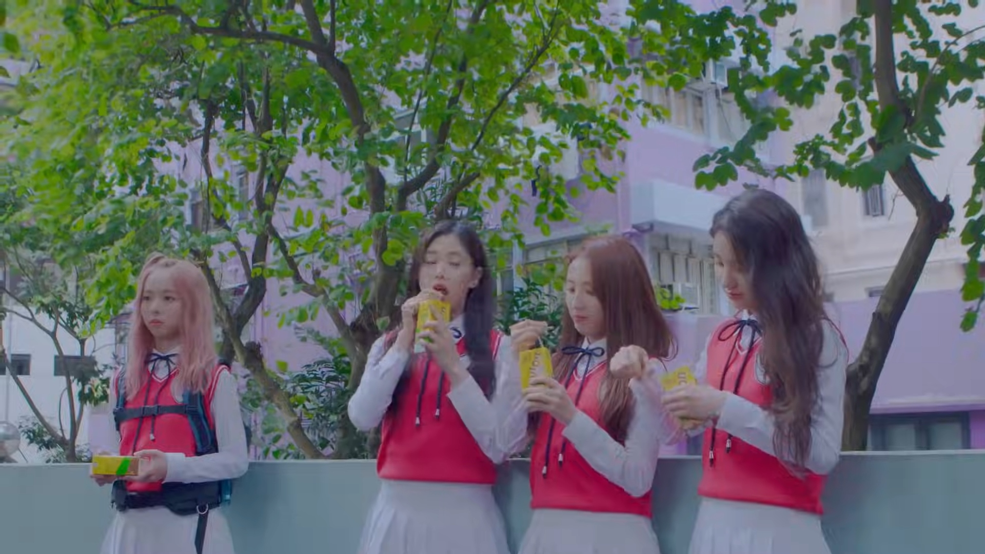 Loona One Third drinking juice boxes. Vivi is only holding hers.